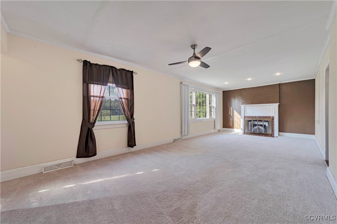 4305 Lakeview Road Petersburg, VA 23803 - Photo 11 of 45 Unfurnished Family room with crown molding, a fire