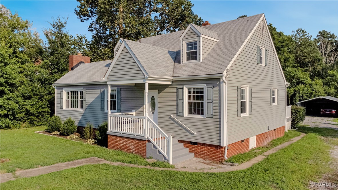 4305 Lakeview Road Petersburg, VA 23803 - Photo 2 of 45 Cape cod house with a front lawn, a chimney, and c