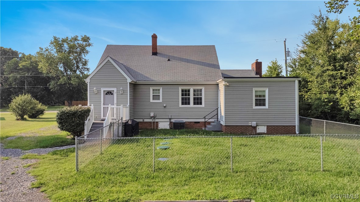4305 Lakeview Road Petersburg, VA 23803 - Photo 42 of 45 Back of property featuring a chimney, a fenced bac
