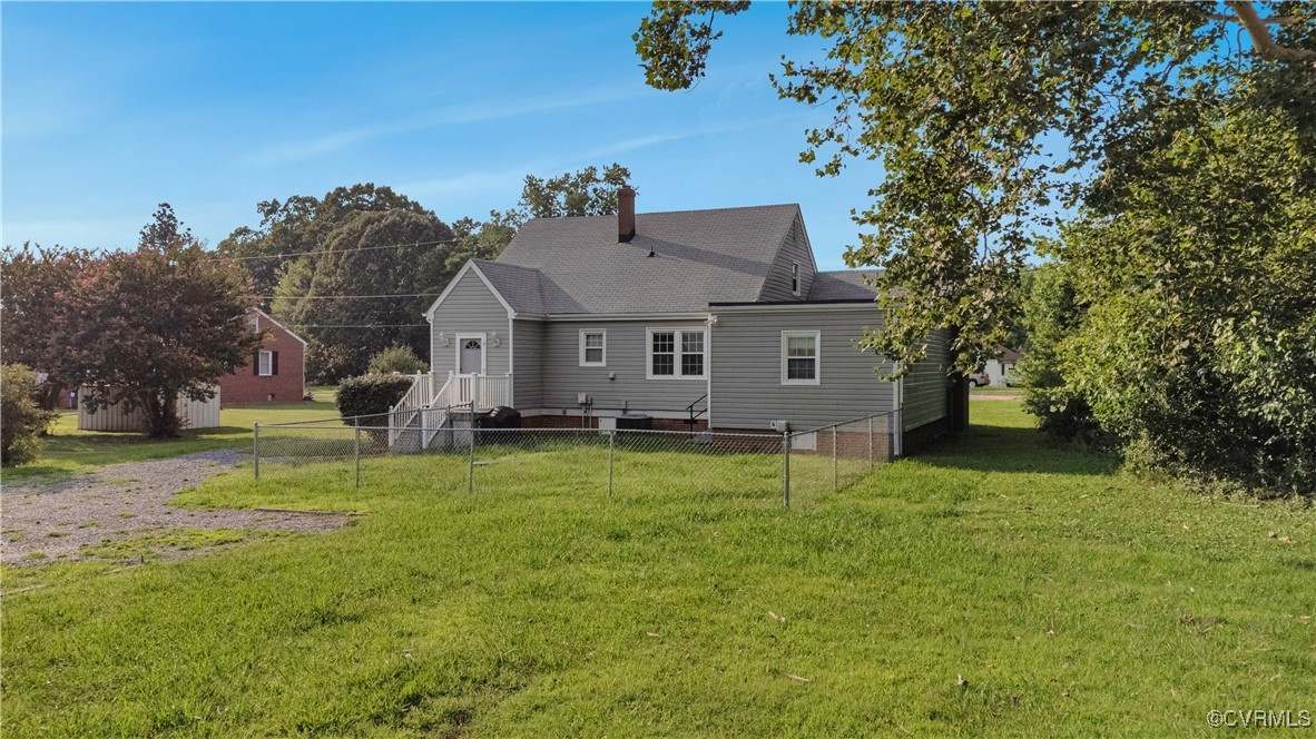 4305 Lakeview Road Petersburg, VA 23803 - Photo 44 of 45 Back of house with a chimney and roof with shingle