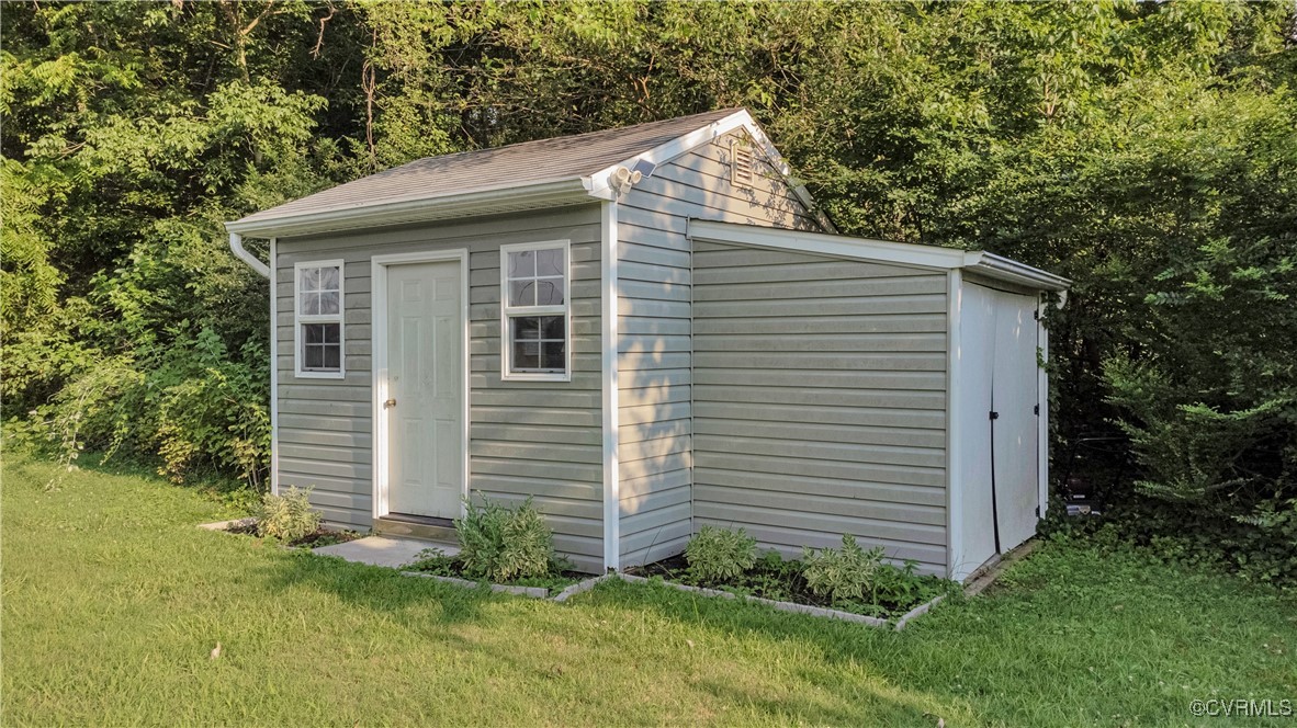 4305 Lakeview Road Petersburg, VA 23803 - Photo 45 of 45 View of tool shed with a wooded view