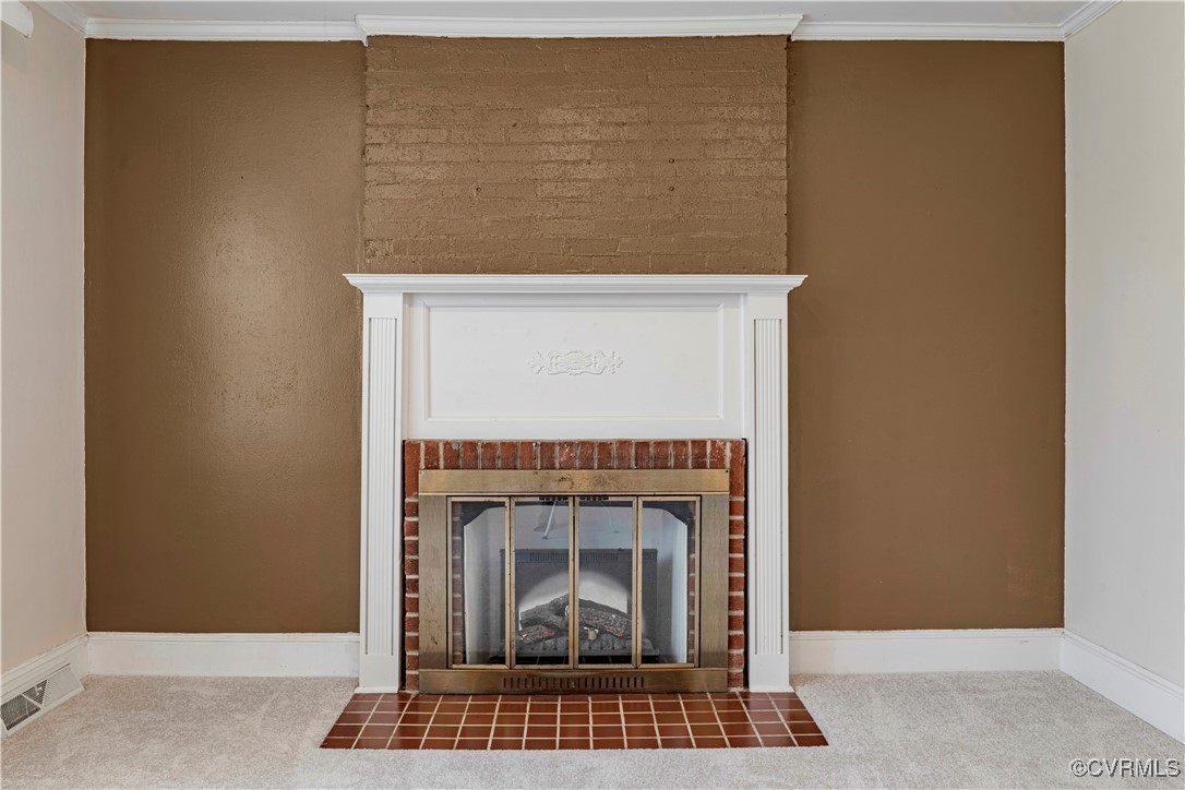 4305 Lakeview Road Petersburg, VA 23803 - Photo 9 of 45 Detailed view of carpet, a fireplace, and crown mo