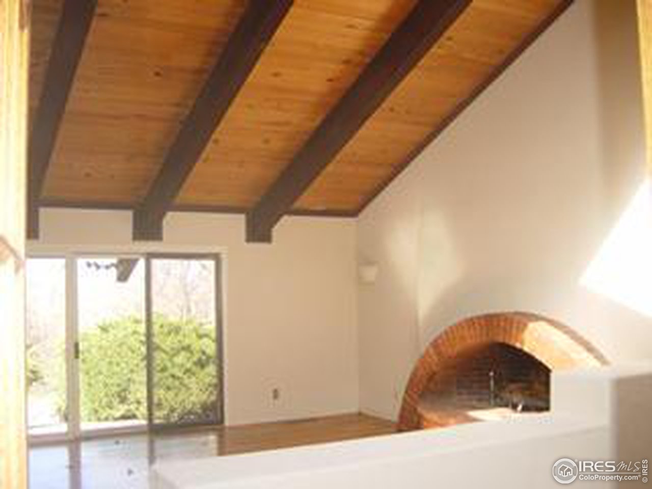 2967 Middle Fork Road Boulder, CO 80302 - Photo 11 of 18 a bedroom with a bed and a large window
