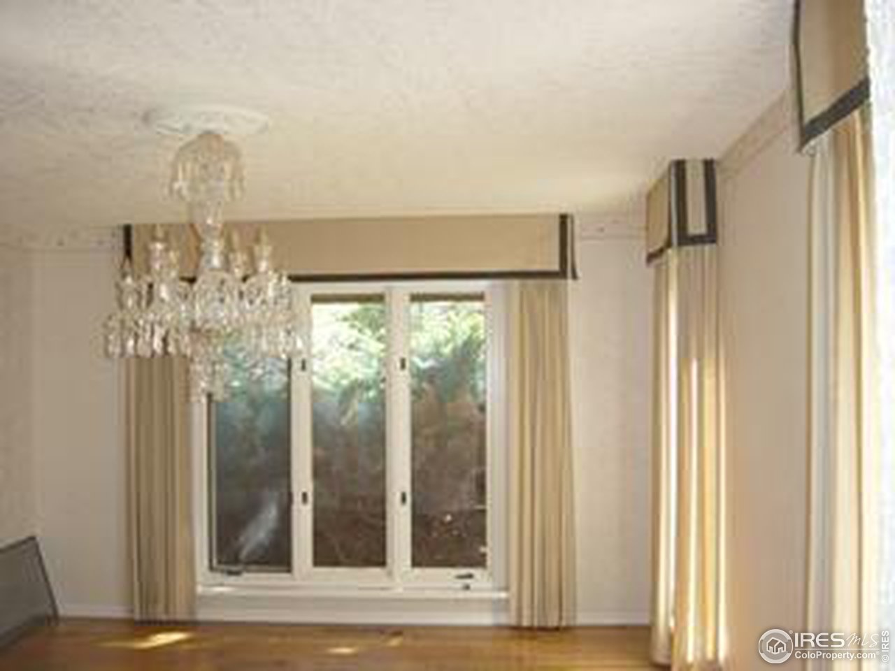 2967 Middle Fork Road Boulder, CO 80302 - Photo 12 of 18 a view of a chandelier fan and kitchen view