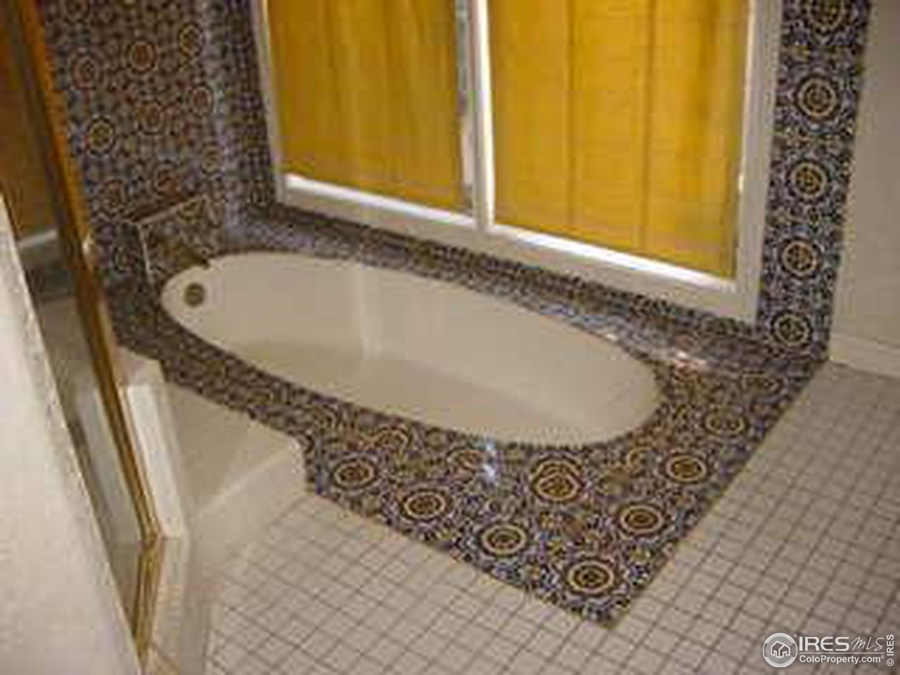 2967 Middle Fork Road Boulder, CO 80302 - Photo 14 of 18 a bathroom with a granite countertop sink and a bathtub