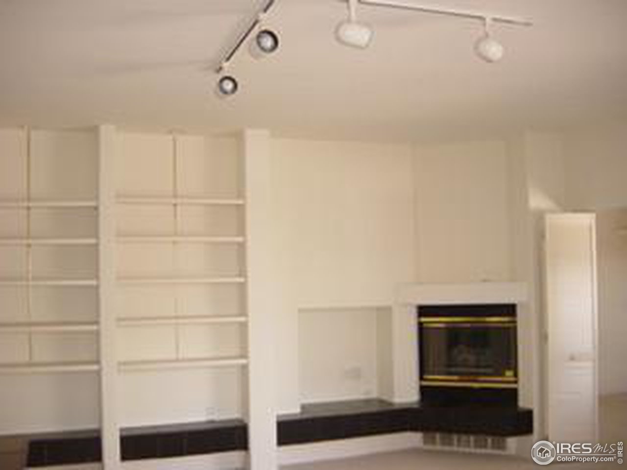 2967 Middle Fork Road Boulder, CO 80302 - Photo 16 of 18 a room with a fireplace and cabinets