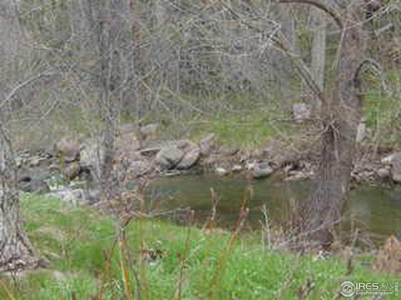 2967 Middle Fork Road Boulder, CO 80302 - Photo 5 of 18 a view of a lake with a yard