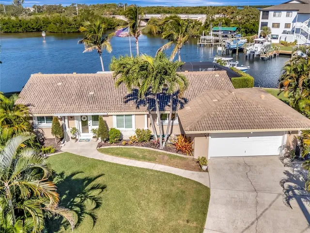 an aerial view of a house with lake view