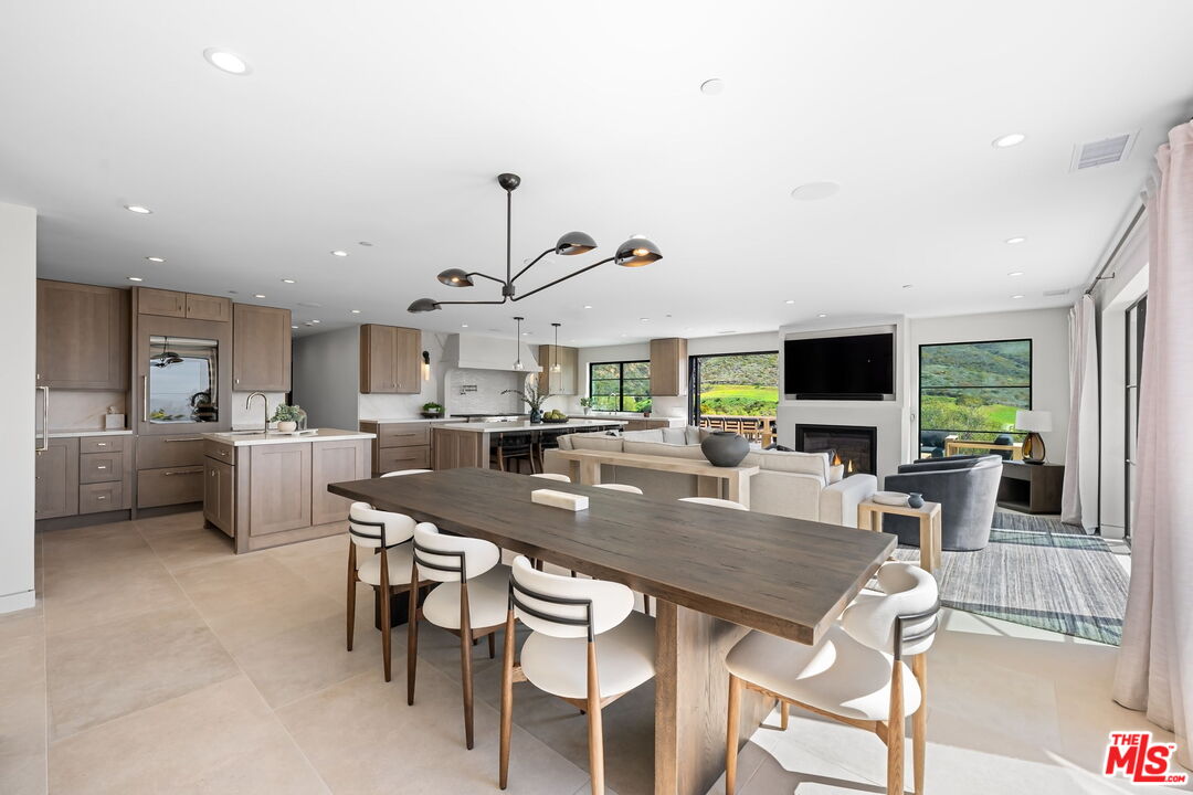6326 Trancas Canyon Road Malibu, CA 90265 - Photo 13 of 53 a view of a dining room with furniture