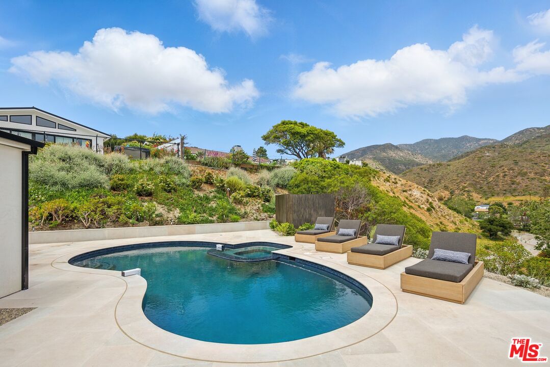 6326 Trancas Canyon Road Malibu, CA 90265 - Photo 2 of 53 a view of a swimming pool with a patio