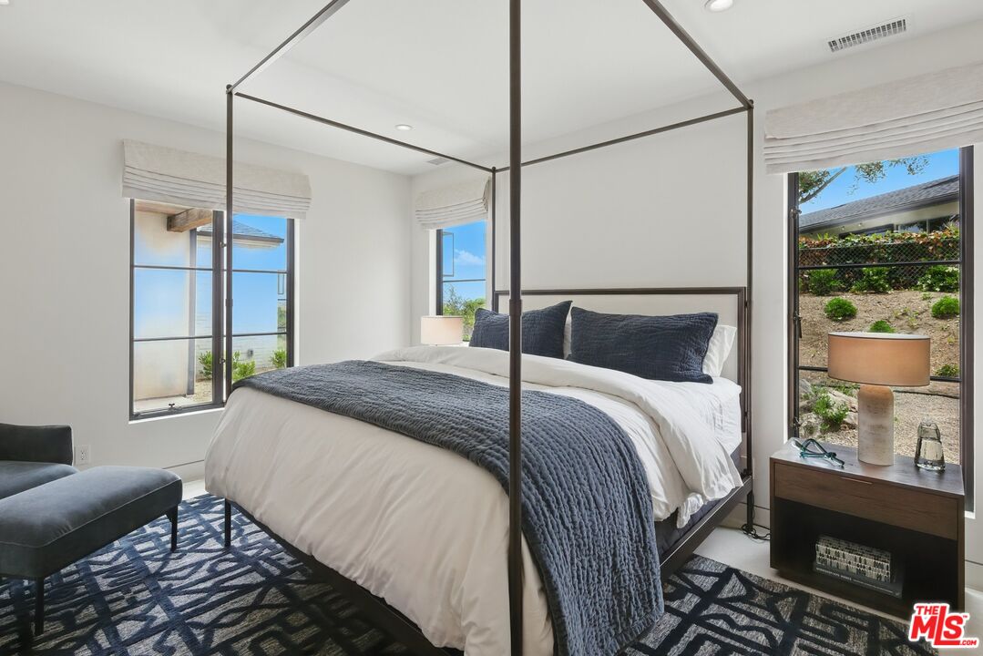 6326 Trancas Canyon Road Malibu, CA 90265 - Photo 35 of 53 a bedroom with a bed and a window