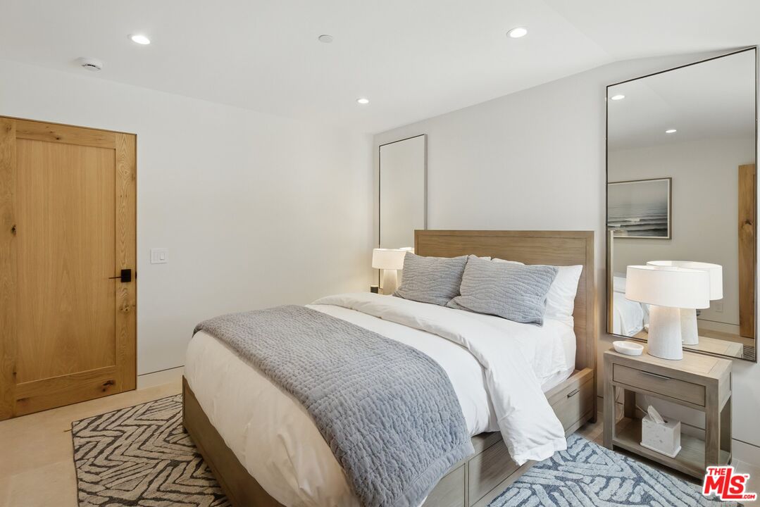 6326 Trancas Canyon Road Malibu, CA 90265 - Photo 38 of 53 a bed room with a bed and a lamp