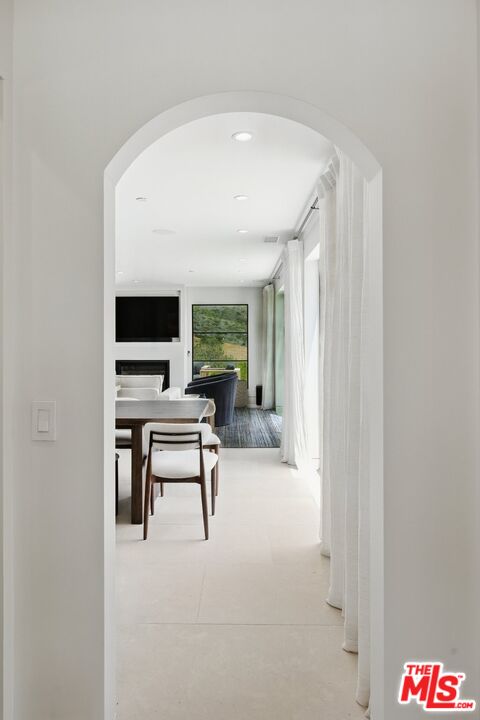 6326 Trancas Canyon Road Malibu, CA 90265 - Photo 39 of 53 a living room with furniture and a flat screen tv