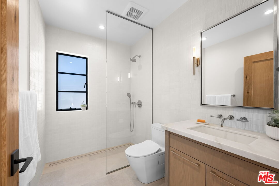 6326 Trancas Canyon Road Malibu, CA 90265 - Photo 45 of 53 a bathroom with a granite countertop sink toilet and shower