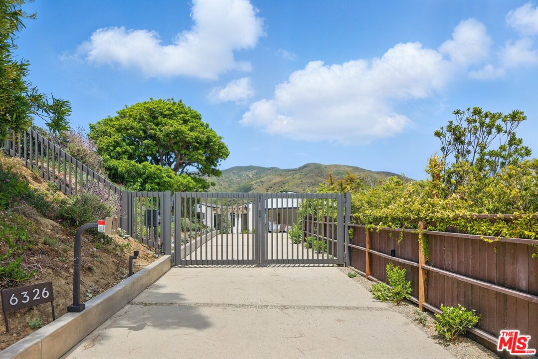 6326 Trancas Canyon Road Malibu, CA 90265 - Photo 50 of 53 a view of a wrought iron fences in front of house