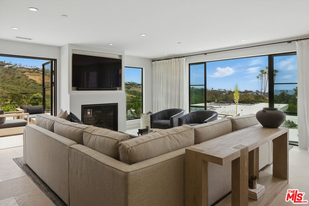 6326 Trancas Canyon Road Malibu, CA 90265 - Photo 7 of 53 a living room with furniture and a large window