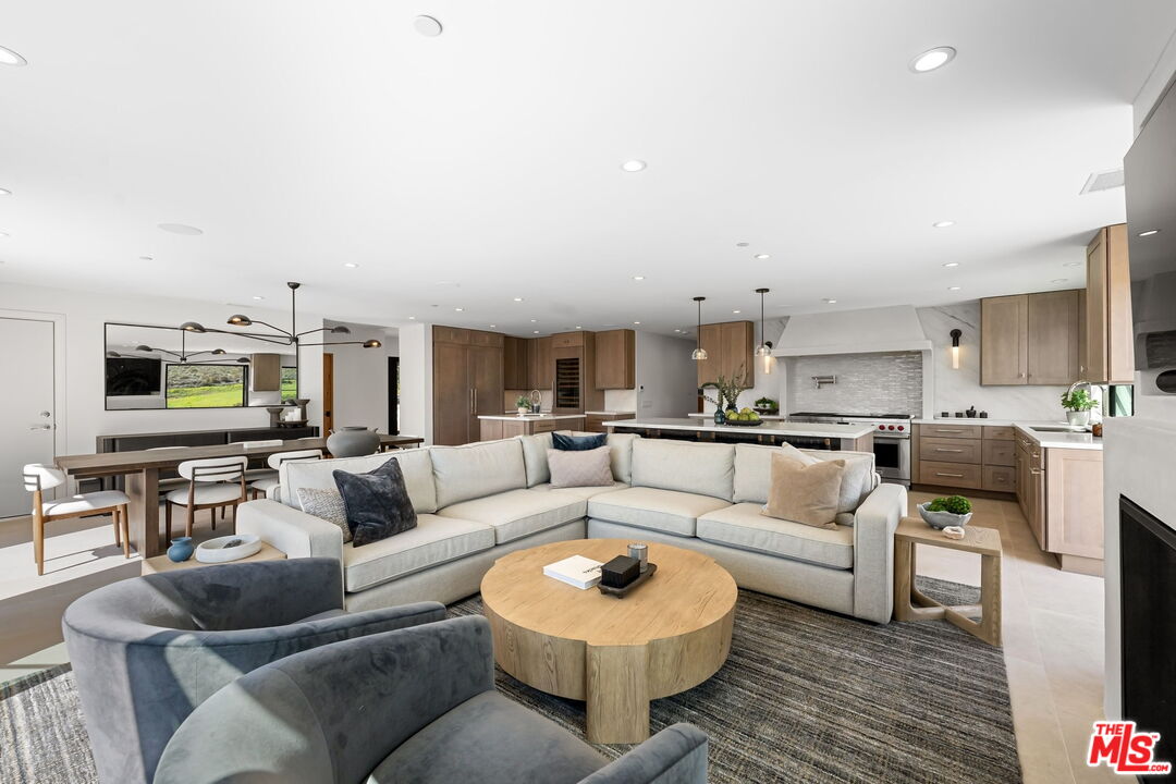 6326 Trancas Canyon Road Malibu, CA 90265 - Photo 9 of 53 a living room with furniture and a flat screen tv