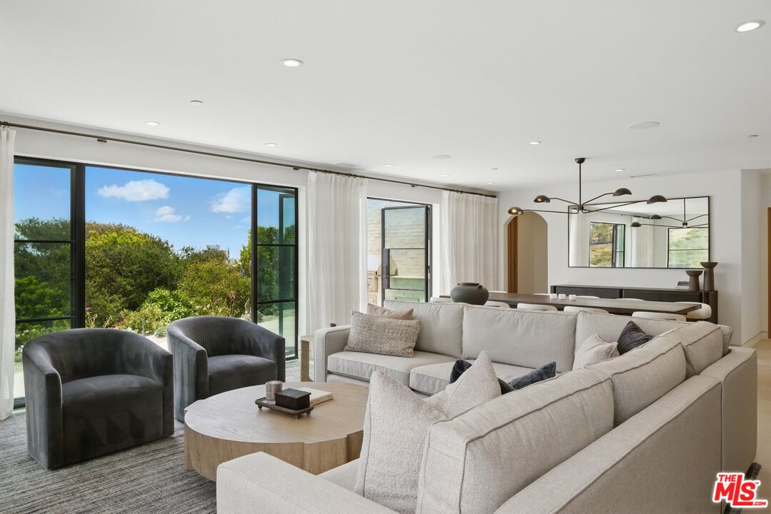 6326 Trancas Canyon Road Malibu, CA 90265 - Photo 10 of 53 a living room with furniture and a large window