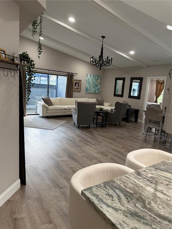 35 Pinewinds Boulevard Oldsmar, FL 34677 - Photo 15 of 36 a living room with furniture and a wooden floor