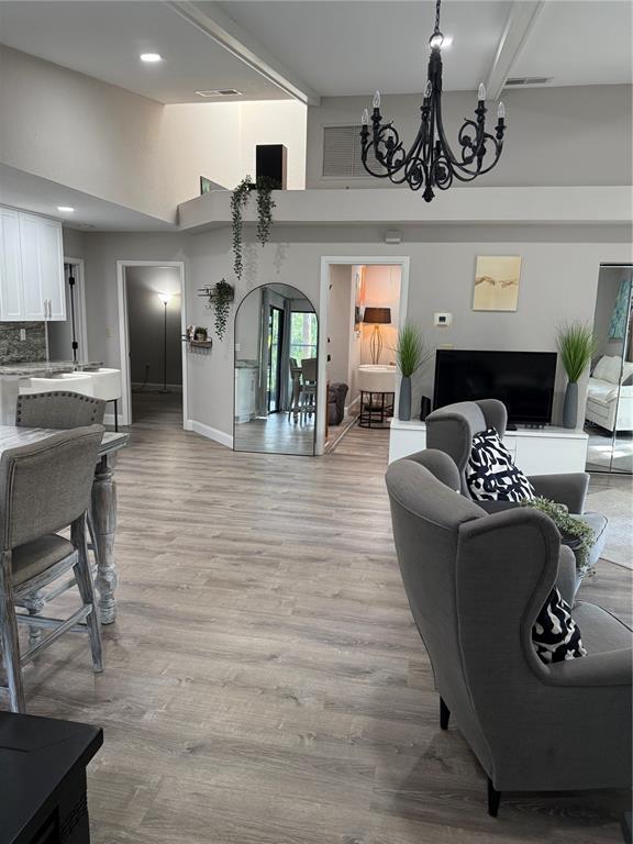 35 Pinewinds Boulevard Oldsmar, FL 34677 - Photo 16 of 36 a living room with furniture and chandelier