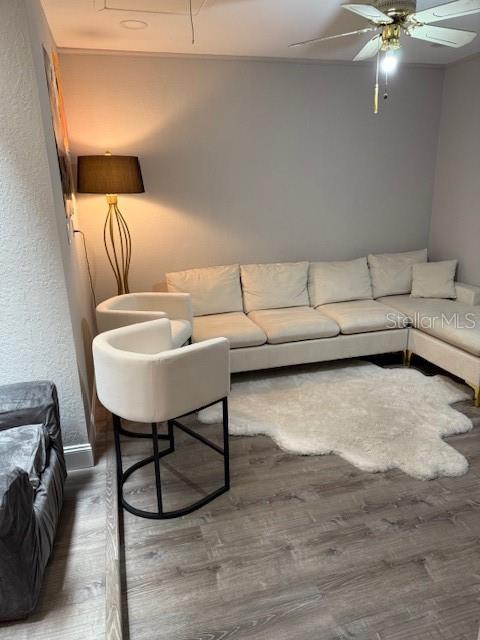 35 Pinewinds Boulevard Oldsmar, FL 34677 - Photo 17 of 36 a living room with furniture and a lamp