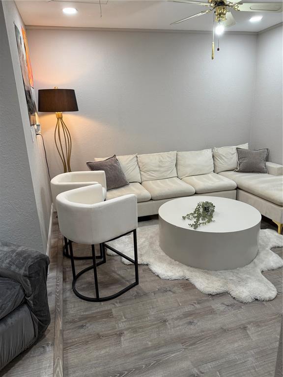 35 Pinewinds Boulevard Oldsmar, FL 34677 - Photo 18 of 36 a living room with furniture and a rug