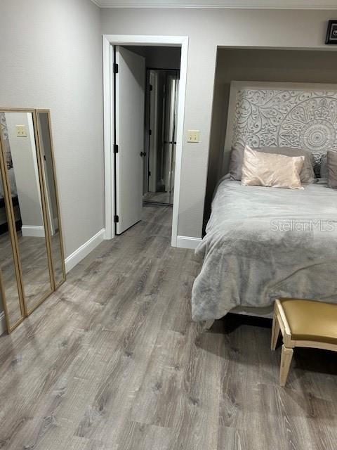 35 Pinewinds Boulevard Oldsmar, FL 34677 - Photo 23 of 36 a bedroom with a bed and a mirror