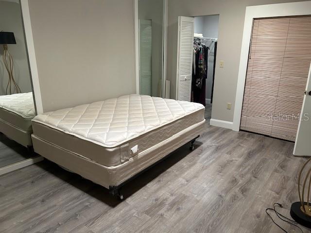 35 Pinewinds Boulevard Oldsmar, FL 34677 - Photo 29 of 36 a bed sitting in a bedroom next to a window