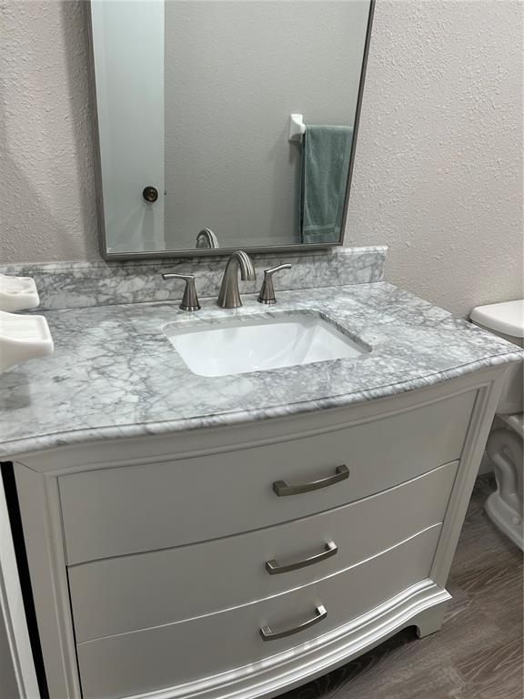35 Pinewinds Boulevard Oldsmar, FL 34677 - Photo 31 of 36 a bathroom with a granite countertop sink and a mirror