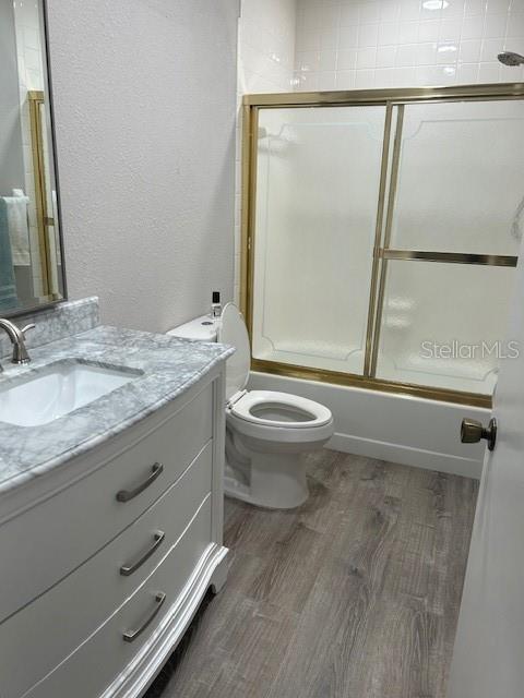 35 Pinewinds Boulevard Oldsmar, FL 34677 - Photo 32 of 36 a bathroom with a granite countertop sink toilet and shower