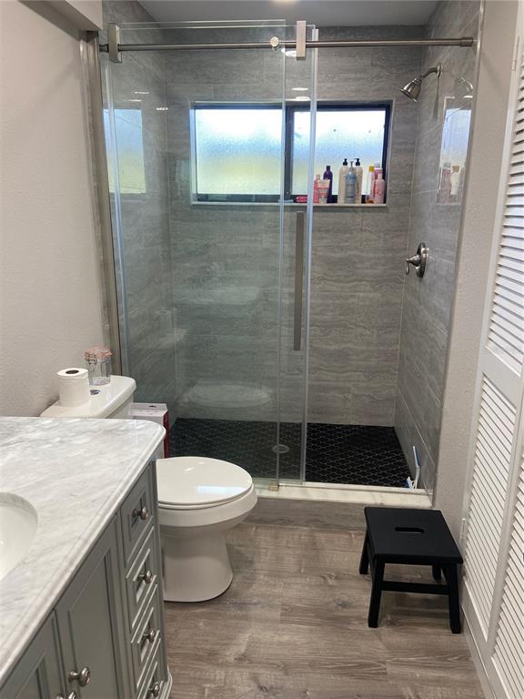 35 Pinewinds Boulevard Oldsmar, FL 34677 - Photo 33 of 36 a bathroom with a sink a toilet and shower