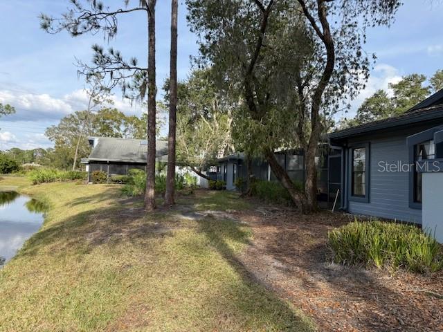 35 Pinewinds Boulevard Oldsmar, FL 34677 - Photo 5 of 36 a view of a house with a tree in a yard