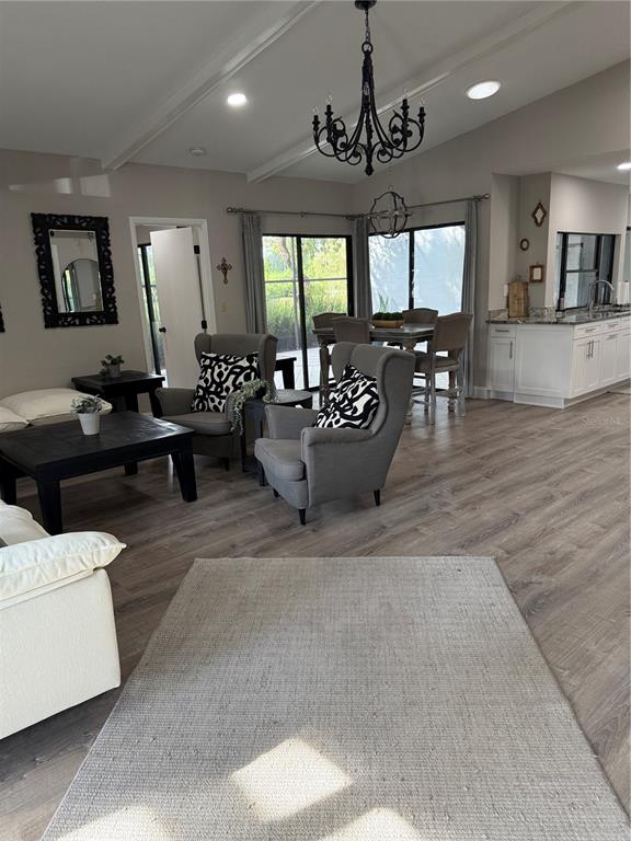 35 Pinewinds Boulevard Oldsmar, FL 34677 - Photo 7 of 36 a living room with furniture and wooden floor