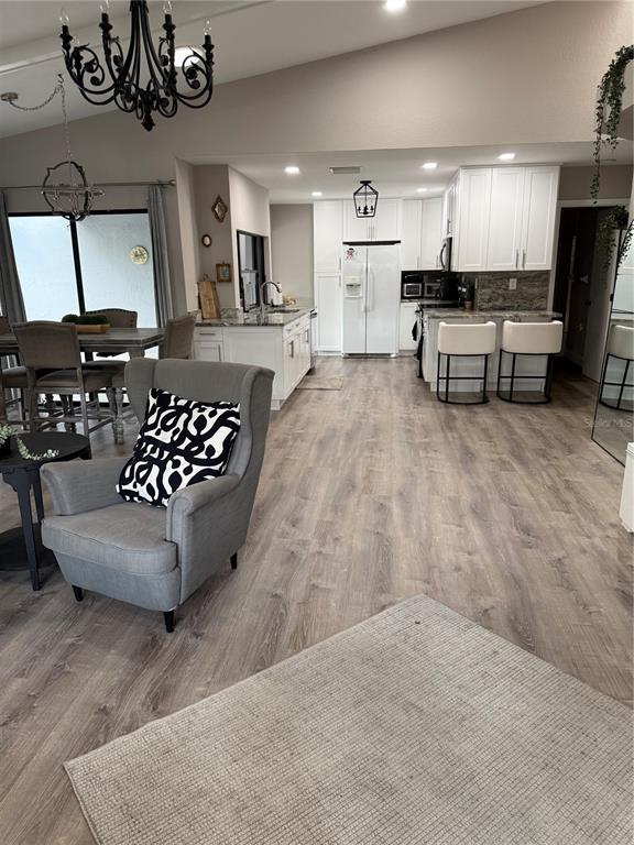 35 Pinewinds Boulevard Oldsmar, FL 34677 - Photo 10 of 36 a living room with furniture and kitchen view