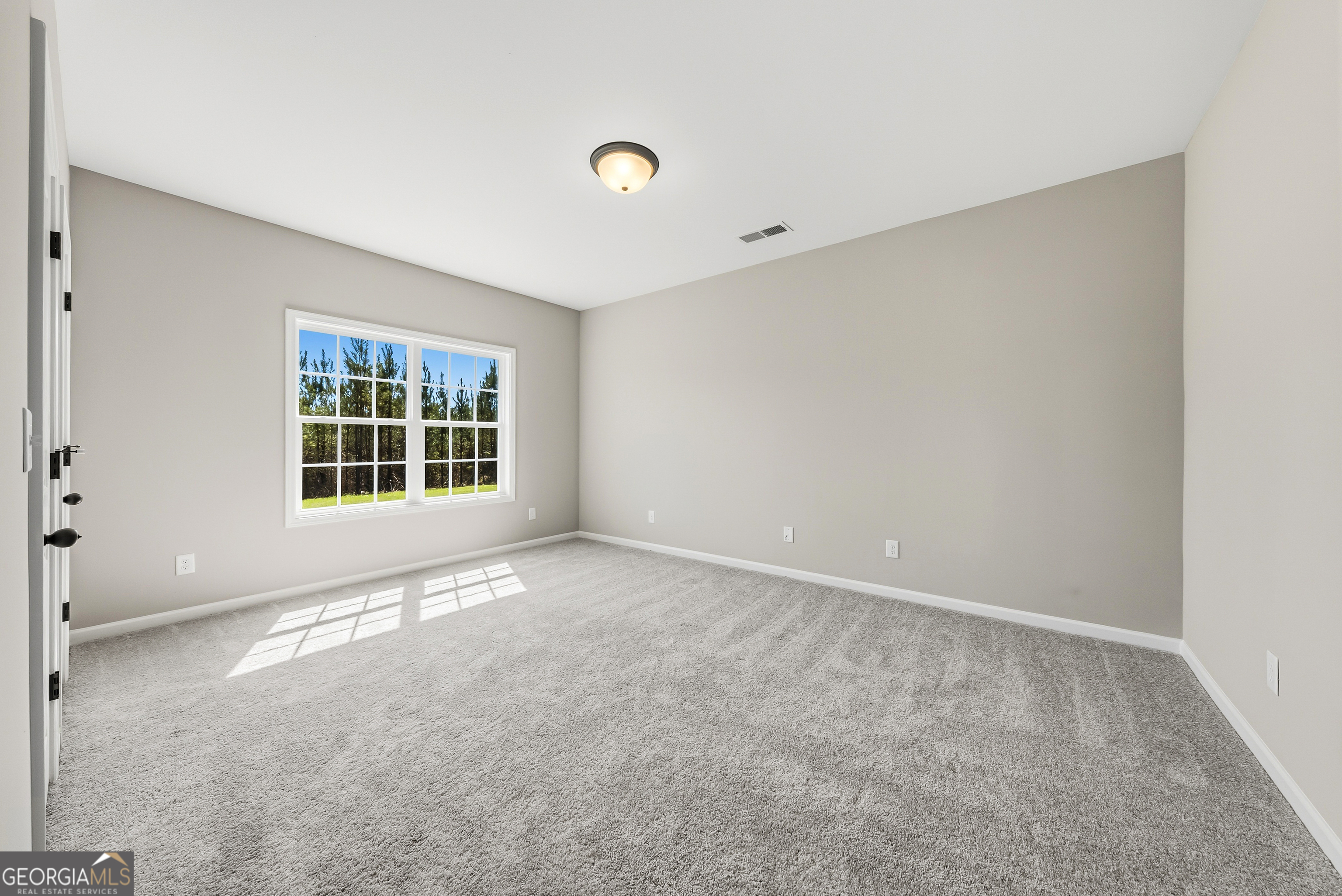 98 Hawkeye Trail, Unit 84 Fortson, GA 31808 - Photo 15 of 42 an empty room with windows