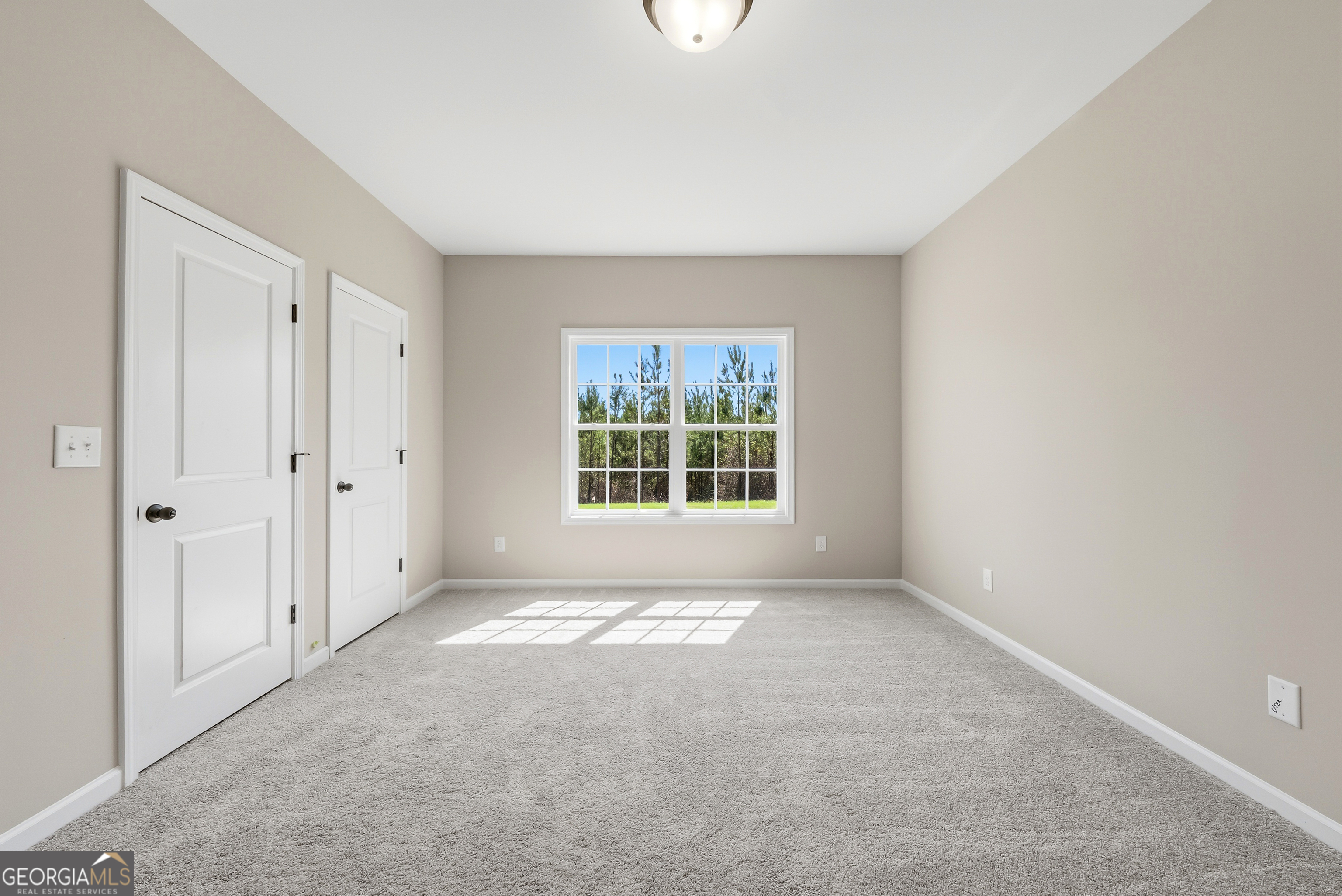 98 Hawkeye Trail, Unit 84 Fortson, GA 31808 - Photo 16 of 42 a view of an empty room with a window