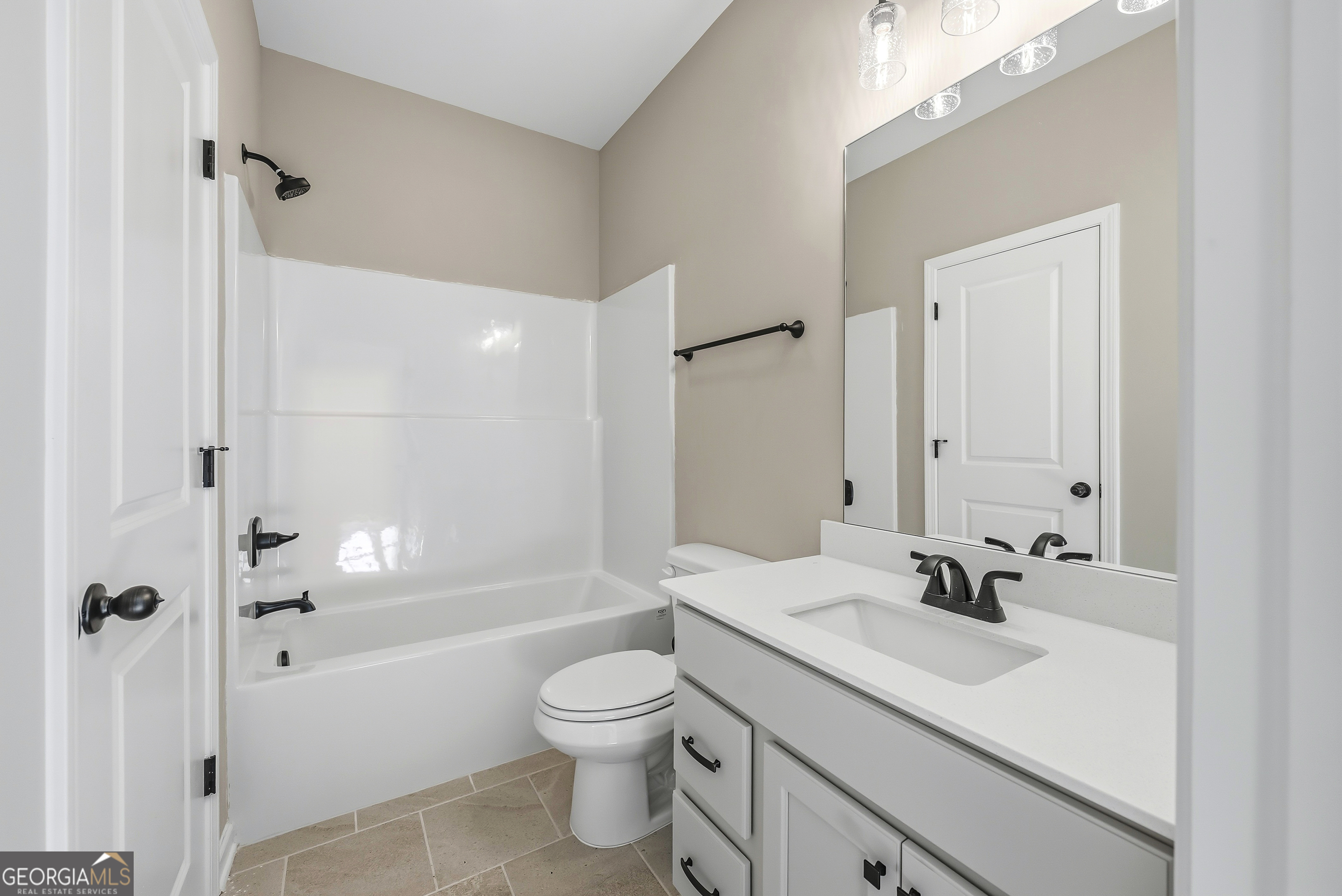 98 Hawkeye Trail, Unit 84 Fortson, GA 31808 - Photo 17 of 42 a bathroom with a sink a toilet and shower