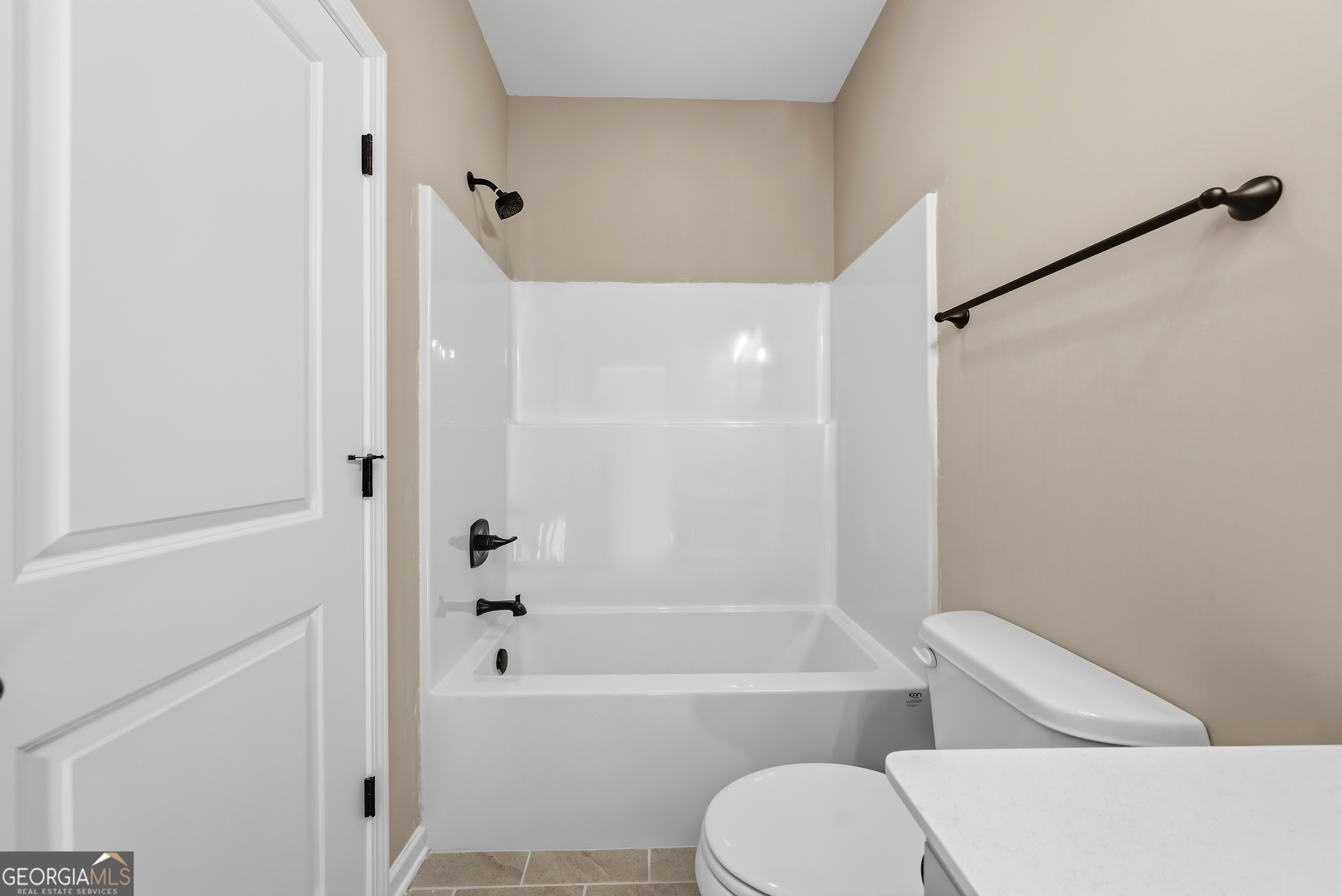 98 Hawkeye Trail, Unit 84 Fortson, GA 31808 - Photo 18 of 42 a bathroom with a toilet and a bathtub