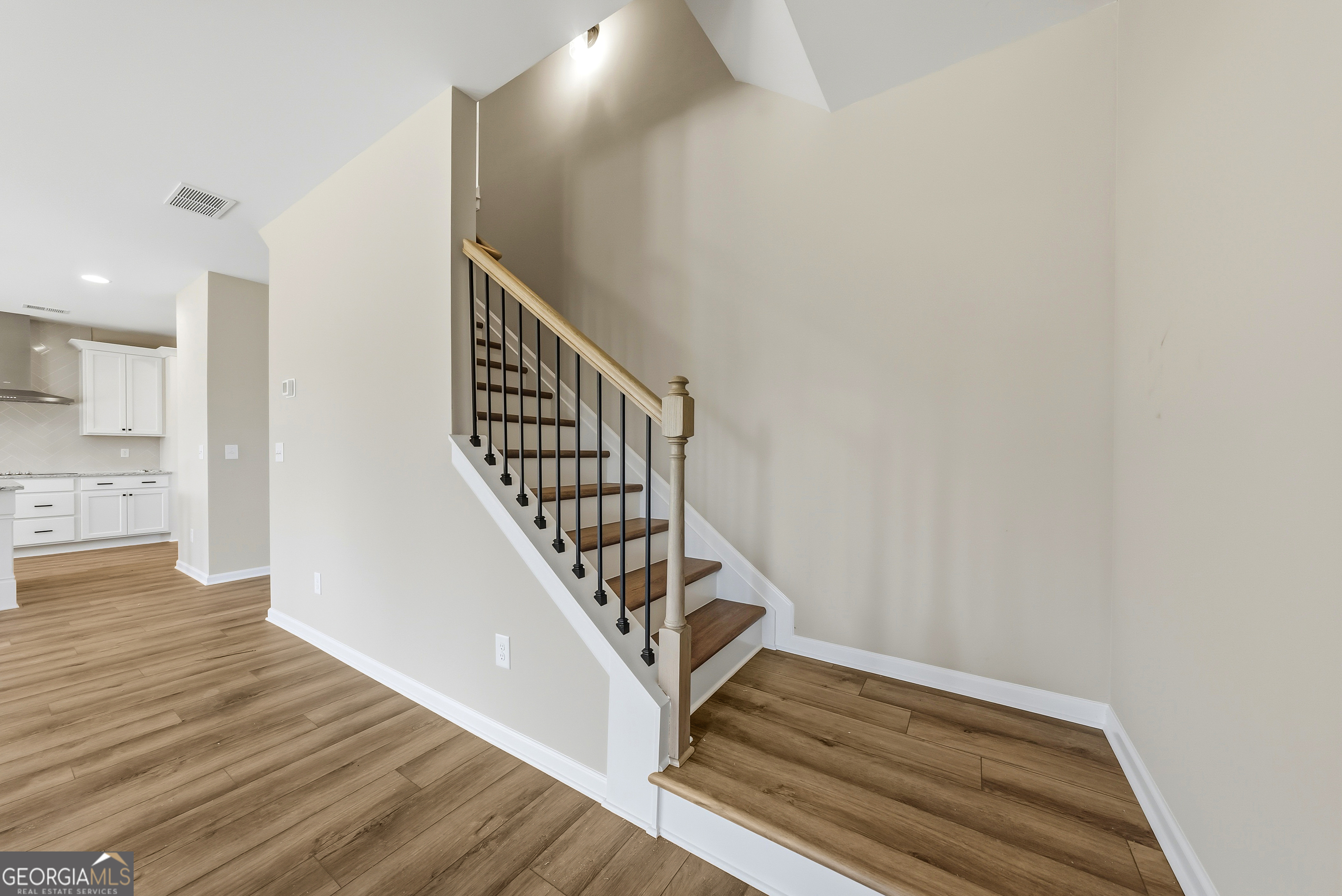 98 Hawkeye Trail, Unit 84 Fortson, GA 31808 - Photo 21 of 42 a view of entryway and hall with wooden floor