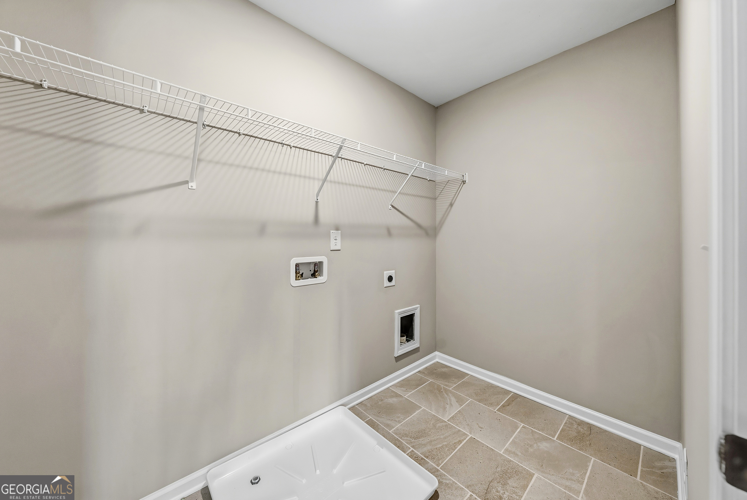 98 Hawkeye Trail, Unit 84 Fortson, GA 31808 - Photo 28 of 42 a view of a room with racks on the wall