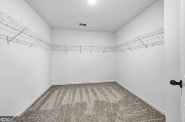 a view of a room with racks on the wall
