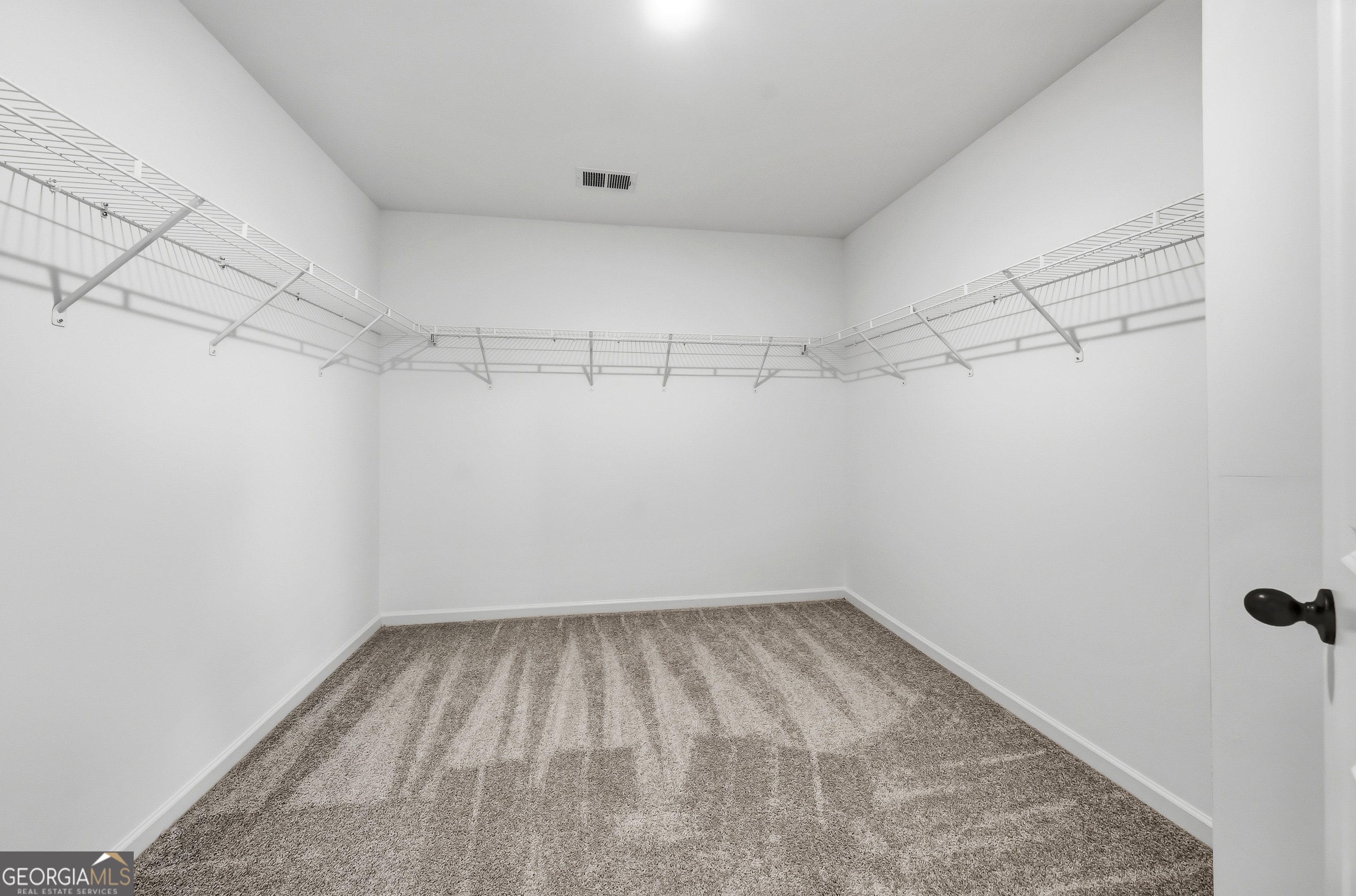 98 Hawkeye Trail, Unit 84 Fortson, GA 31808 - Photo 31 of 42 a view of a room with racks on the wall