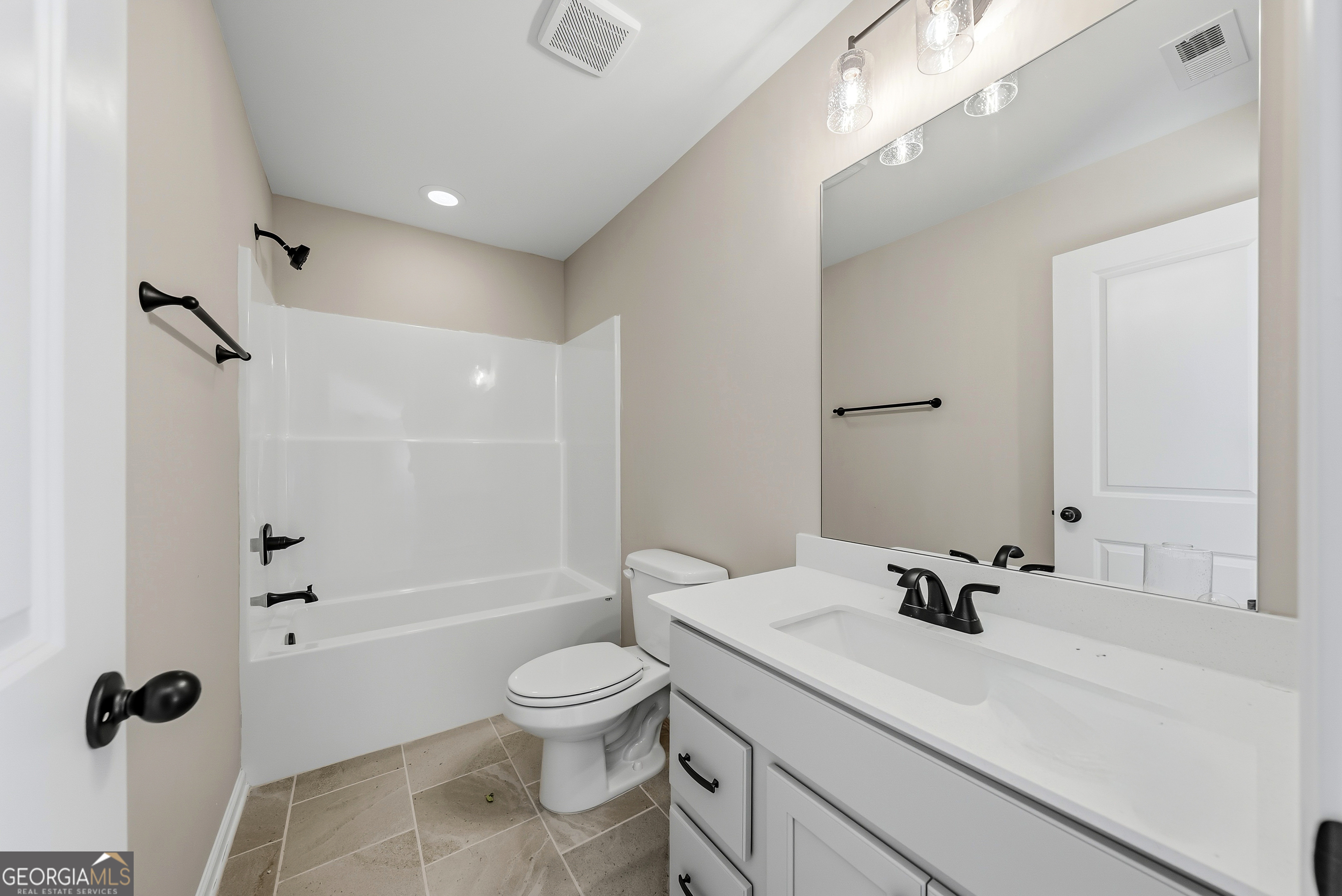 98 Hawkeye Trail, Unit 84 Fortson, GA 31808 - Photo 32 of 42 a bathroom with a sink a toilet and shower