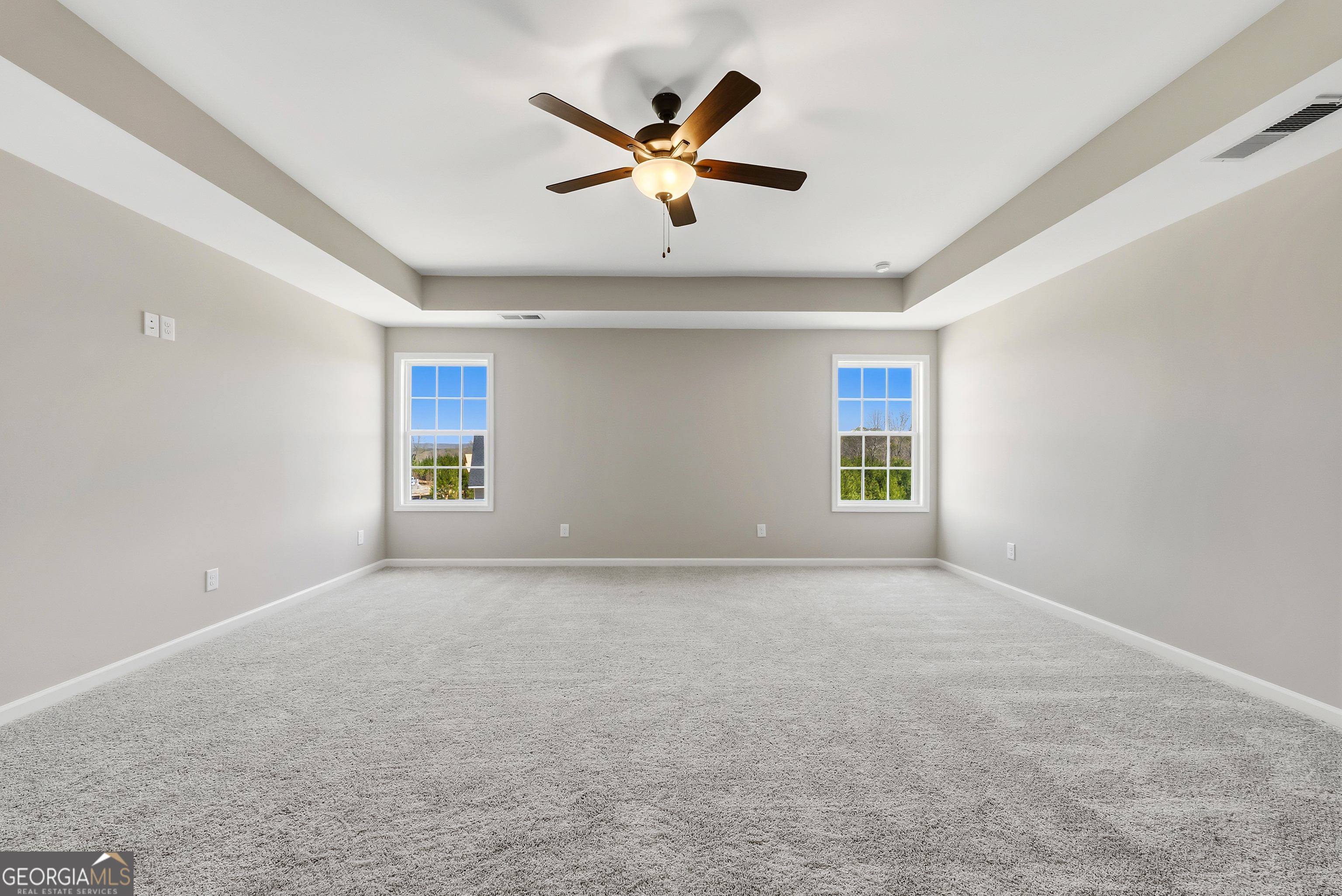 98 Hawkeye Trail, Unit 84 Fortson, GA 31808 - Photo 35 of 42 a view of an empty room with a ceiling fan