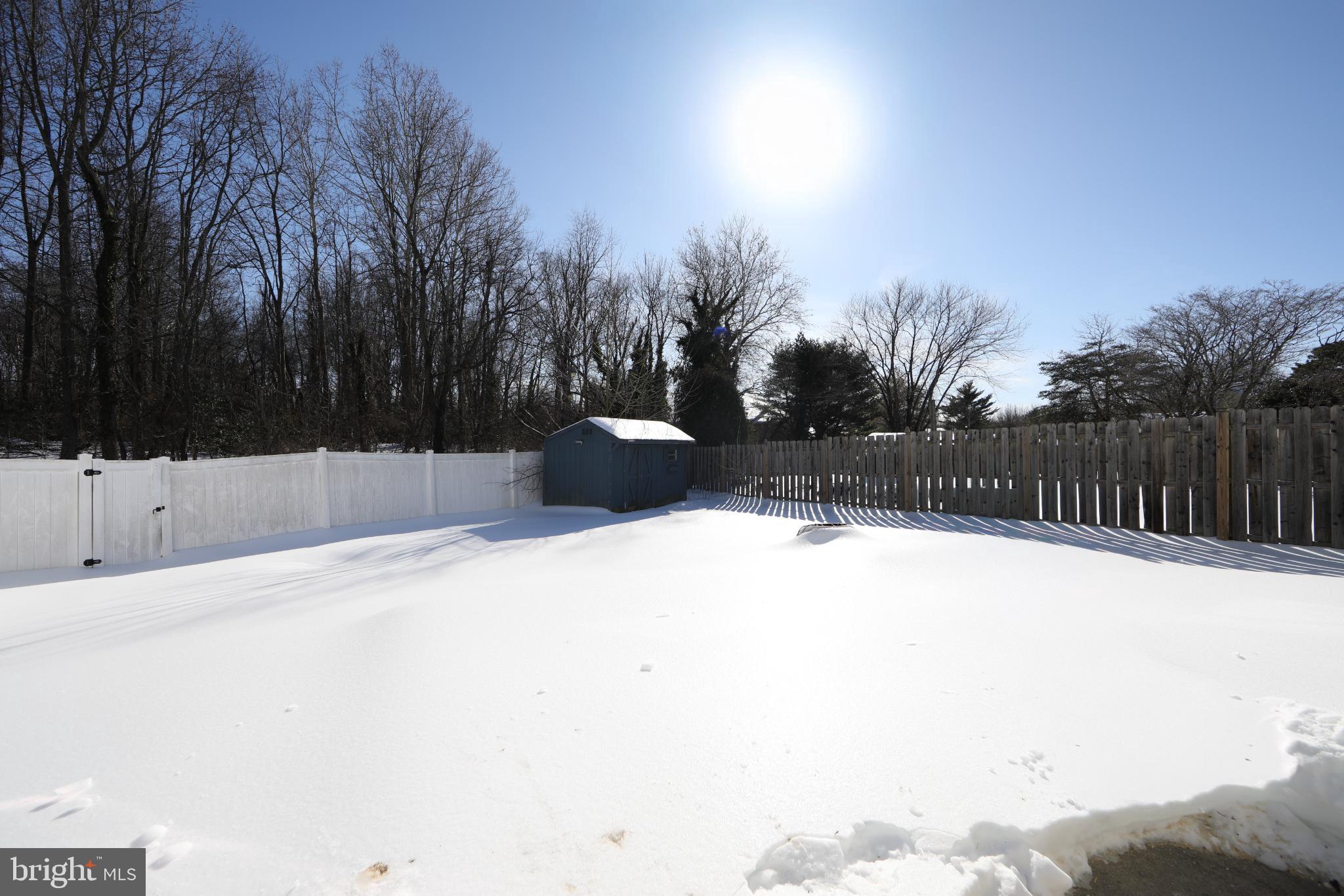 131 Crossing Way Lindenwold, NJ 08021 - Photo 26 of 34 Winter's embrace: a serene snowy landscape.