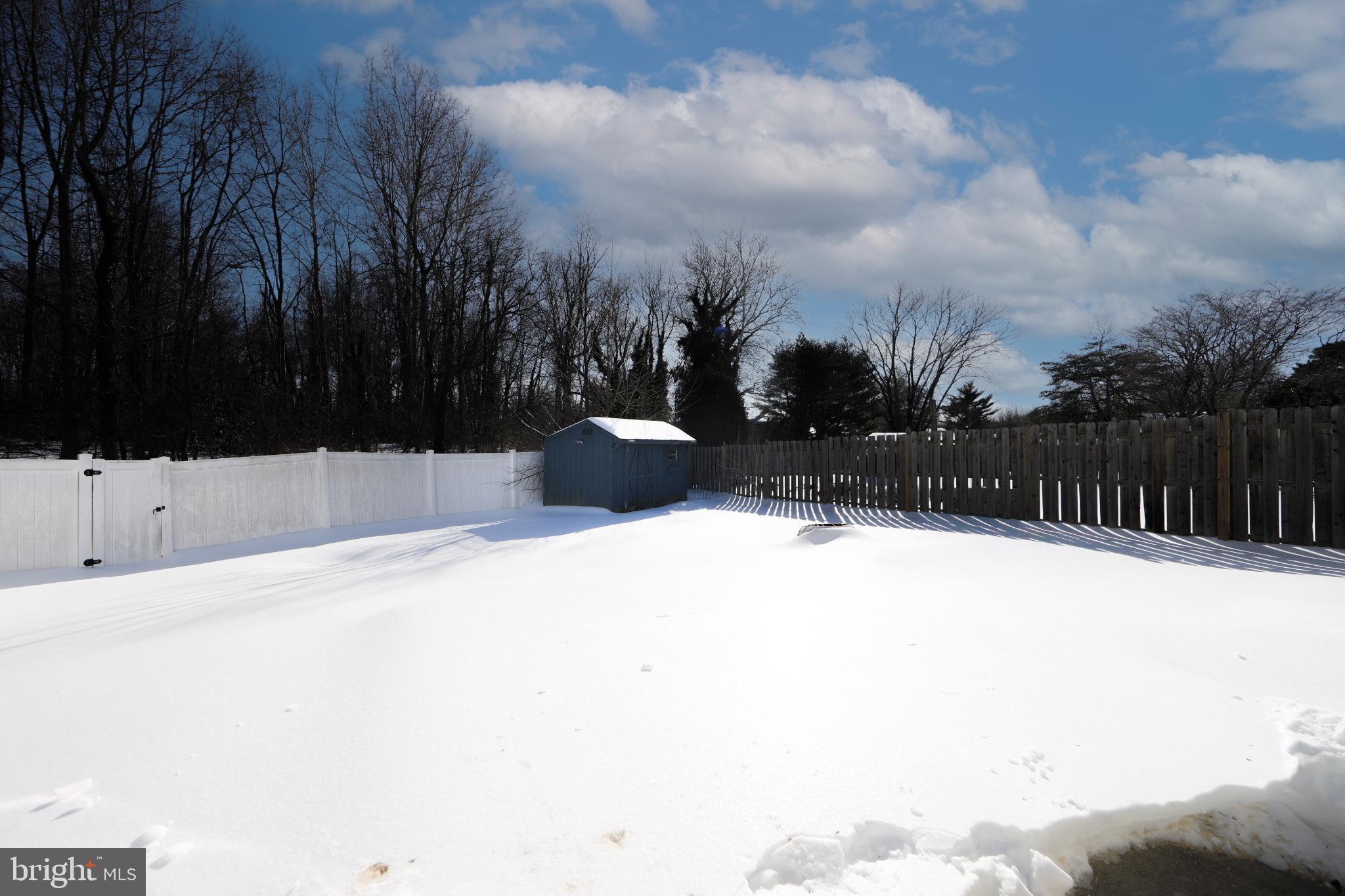 131 Crossing Way Lindenwold, NJ 08021 - Photo 27 of 34 Snow-covered yard under a bright sky.