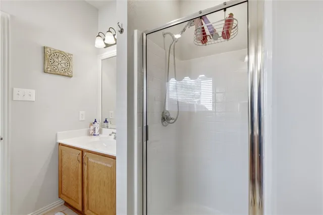 a bathroom with a shower and a sink