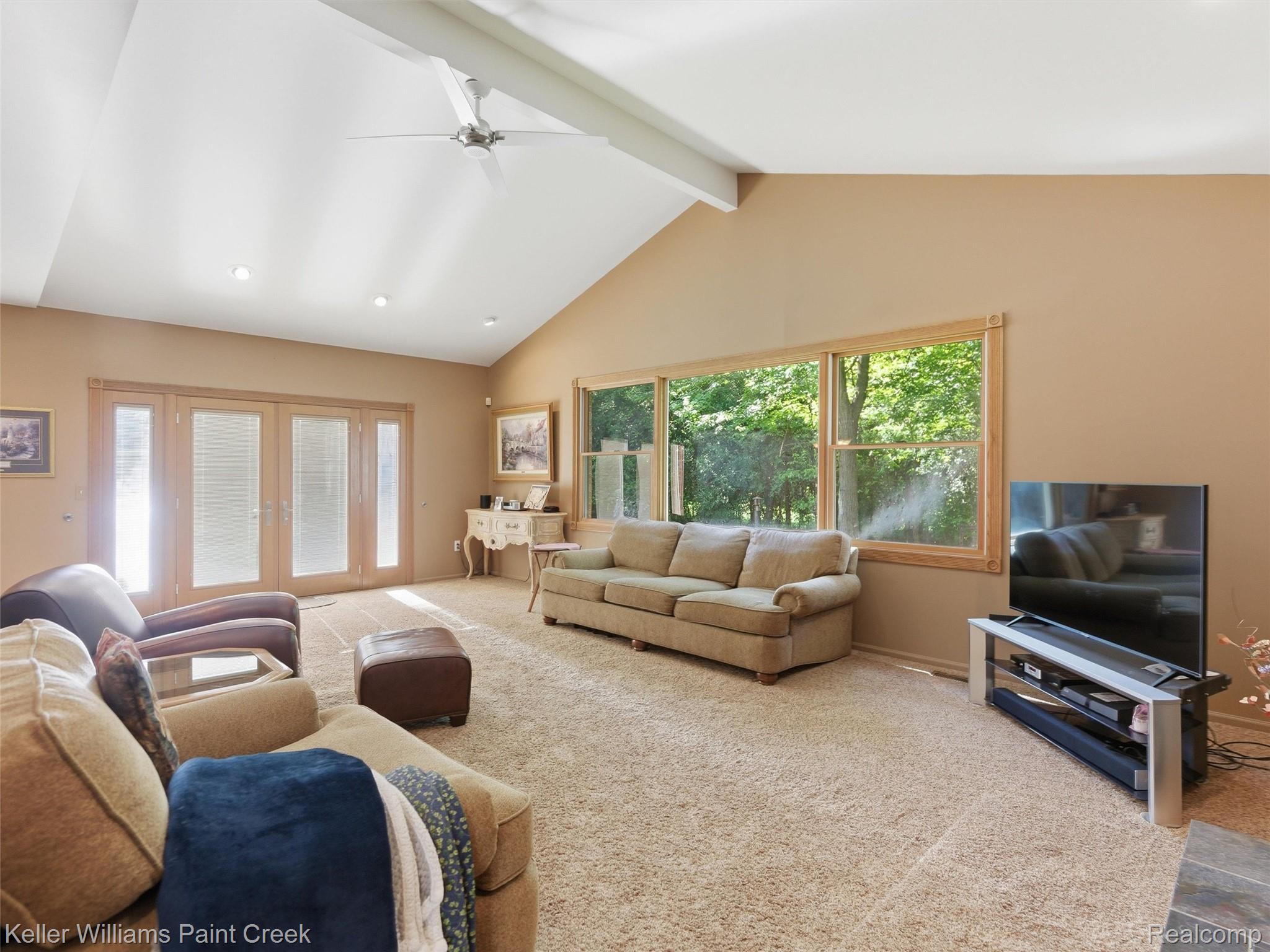 2842 Manorwood Road Troy, MI 48085 - Photo 30 of 72 Spacious living area featuring a vaulted ceiling with exposed beam, recessed lighting, and ceiling fan