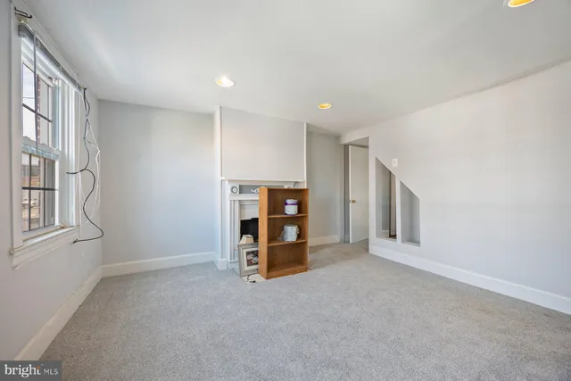 a view of livingroom with furniture and fireplace