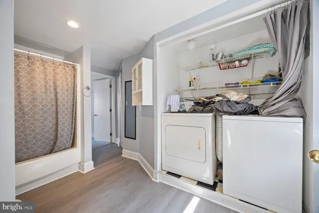 a bathroom with a sink a mirror and shower